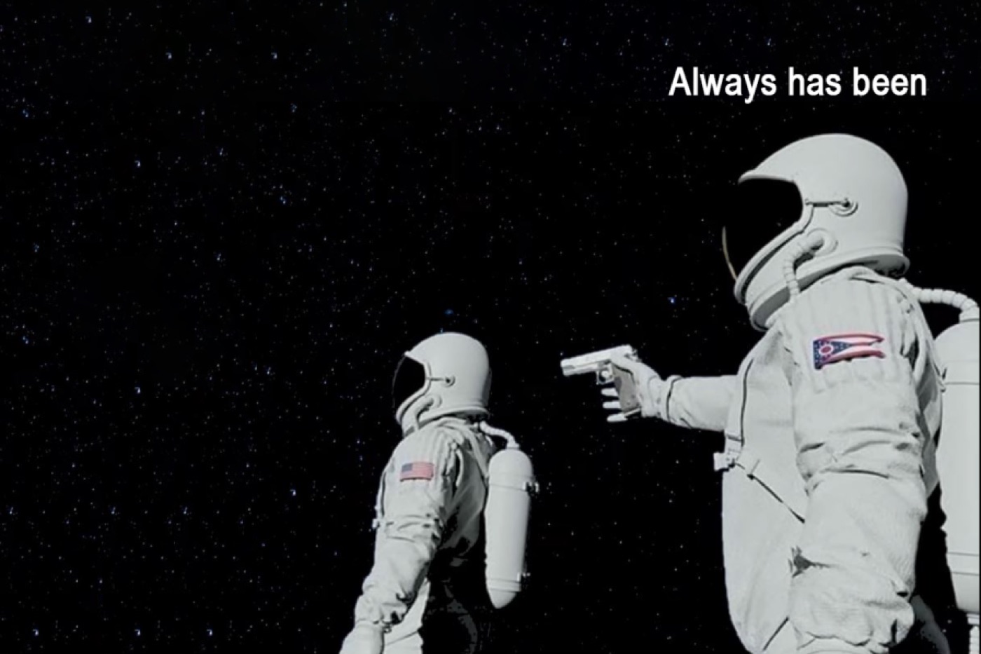 Two astronauts, one pointing a gun, 'always has been' format